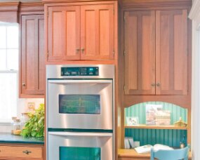 24-03 Wood : Sapele (Wood specie no longer available. Shown for style only); Finish : Burnt Umber; Door Style : Stratford; Face Frame : Beaded Inset