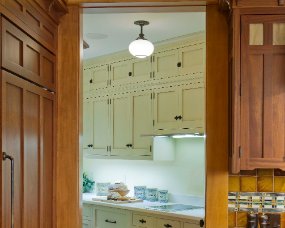 89-10 [Pantry] Wood : Maple; Paint color : Antique White with Mocha glaze; Door Style : Bristol; Face Frame : Square Inset [Perimeter cabinetry] : Wood : Sapele (Wood...